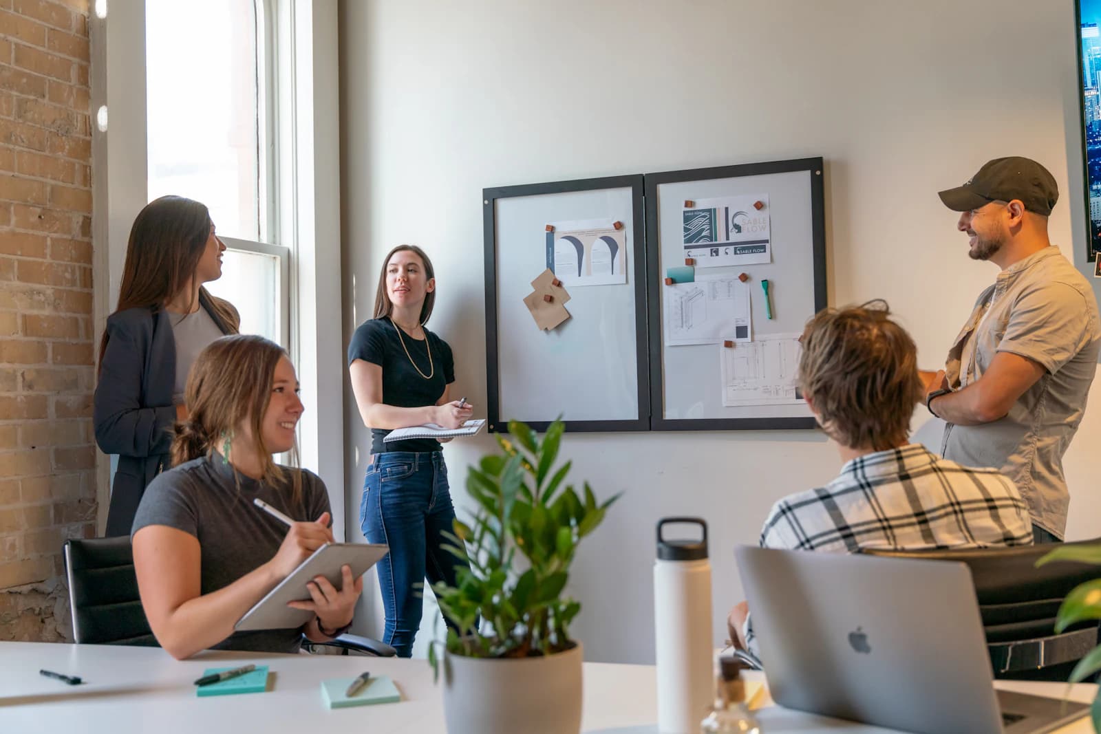 A team working together in a sunlit open-plan office